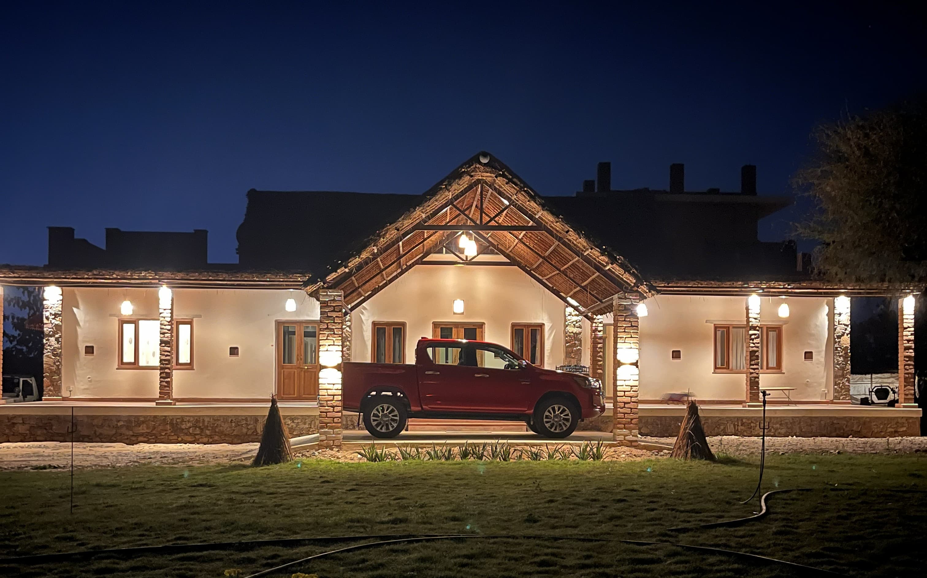 A quiet family-owned grove stay near Pushkar Lake at golden hour